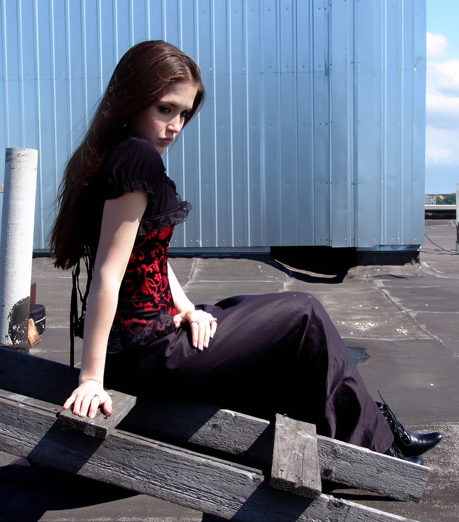 Brunette Gothic Girl wearing Black Long Dress and Black Shoes